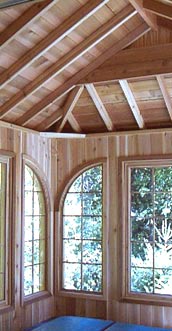 spa enclosure interior view showing cedar rafters, roof planking, and finished cedar interior