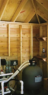 pool house interior showing interor framing and pool equipment